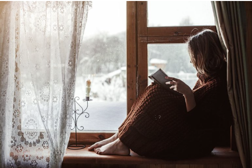 woman sitting and reading